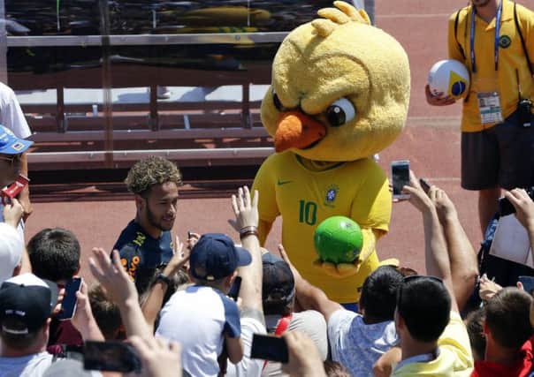 Brazil's mascot holds a football as fans cheer Neymar in Sochi, Russia. Picture: AP