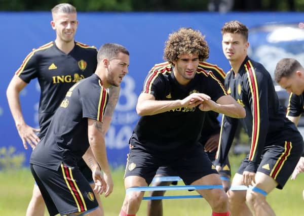 Belgium's Eden Hazard, left, and Marouane Fellaini warm up in training ahead of the World Cup quarter-final against Brazil. Picture: AP Photo