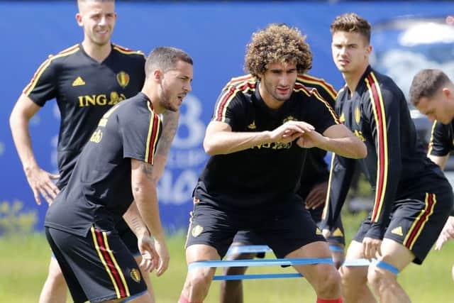 Belgium's Eden Hazard, left, and Marouane Fellaini warm up in training ahead of the World Cup quarter-final against Brazil. Picture: AP Photo