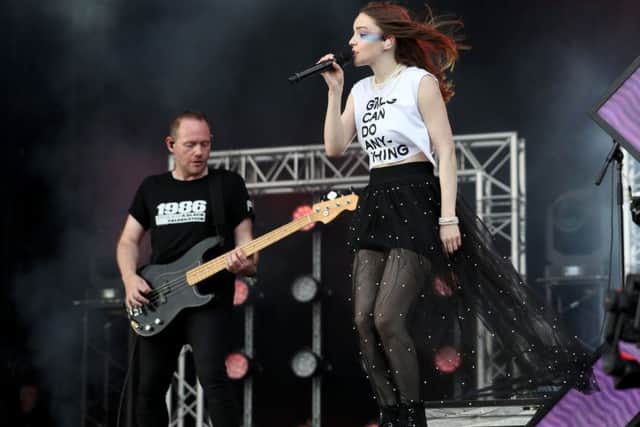 Lauren Mayberry and Iain Cook from the CHVRCHES perform on the main stage. Picture: Jane Barlow/PA Wire