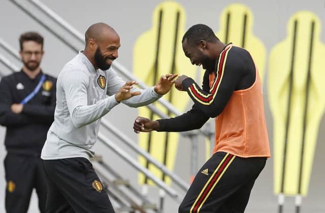 Belgium assistant coach Thierry Henry, left, jokes with Romelu Lukaku during training. Picture: Alexander Zemlianichenko/AP