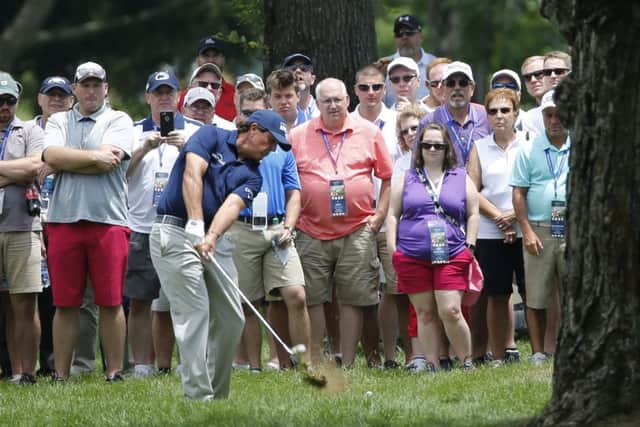 Phil Mickelson hits out of the rough on the 11th hole at The Greenbrier.  Picture: Steve Helber/AP