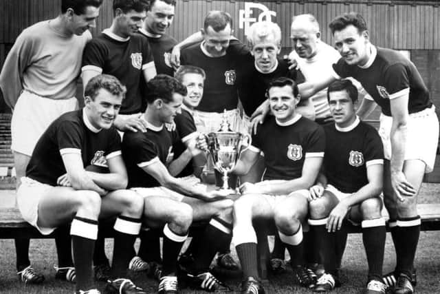 The Dundee players with the First Division trophy after the 1961-1962 season.
Back row left to right: Pat Liney, Gordon Smith, Alan Gilzean, Bobby Wishart, Ian Ure, trainer Sammy Kean and right half Bobby Seith.
Front row: Andy Penman, Bobby Cox, Alex Hamilton, Alan Cousin and Hugh Robertson.