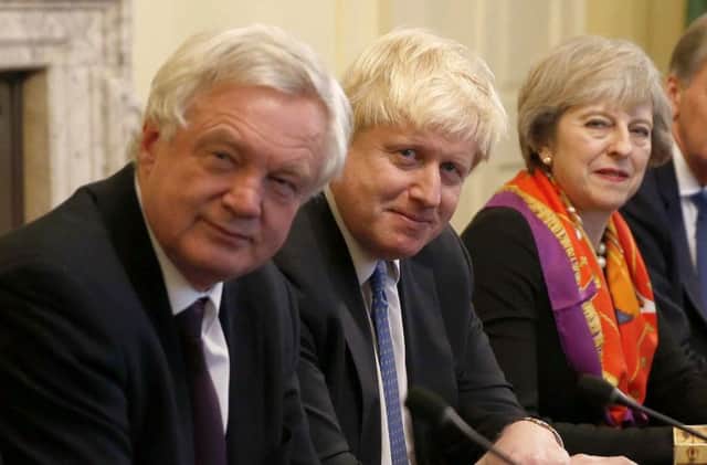 Prime Minister Theresa May with now resigned ministers, David Davis and Boris Johnson in the Cabinet Room inside 10 Downing Street. Picture; Getty