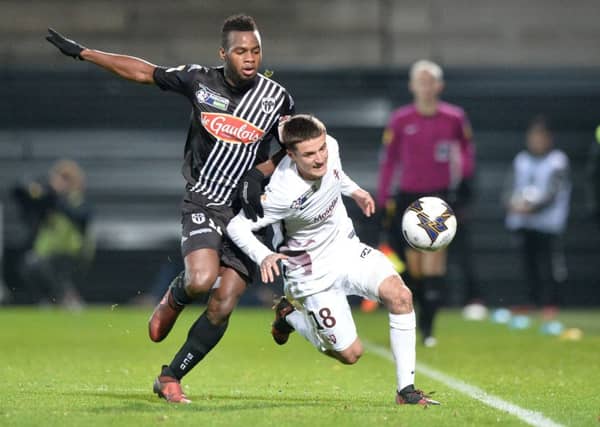 Lassana Coulibaly (L) vies with Metz midfielder Vincent Thill during a French League Cup match in December 2017. Picture: AFP/Getty Images