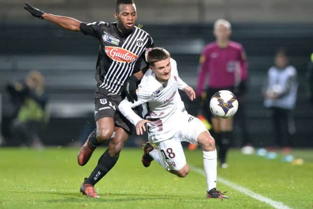 Lassana Coulibaly (L) vies with Metz midfielder Vincent Thill during a French League Cup match in December 2017. Picture: AFP/Getty Images