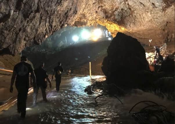 This photo tweeted by Elon Musk shows efforts underway to rescue trapped members of a youth soccer team from a flooded cave in northern Thailand. (Courtesy of Elon Musk via AP)