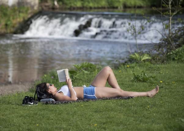 Those days of enjoying a good book in the park in the sunshine could soon be over. Picture: John Devlin.