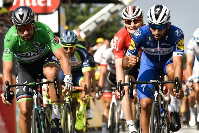 Colombia's Fernando Gaviria, right, crosses the line ahead of Slovakia's Peter Sagan. Picture: Marco Bortorello/AFP/Getty