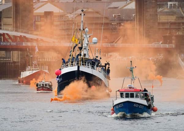 An armada of Brexit-supporting fishermen sail up the River Tyne (Picture: Getty)