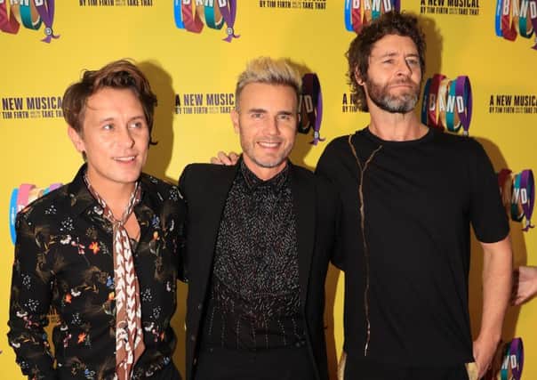 Mark Owen, Gary Barlow, and Howard Donald of Take That