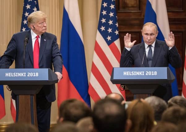 U.S. President Donald Trump (L) and Russian President Vladimir Putin answer questions about the 2016 U.S Election collusion during a joint press conference. Picture: Chris McGrath/Getty Images)