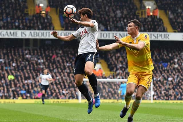 Jake Cooper (R) vies iwth Tottenham's Heung-Min Son during an English FA Cup match. Picture: Getty Images