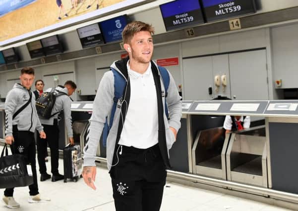 Josh Windass completes check-in at Glasgow Airport yesterday as Rangers set off for their Europa League qualifier in Macedonia. Picture: SNS.