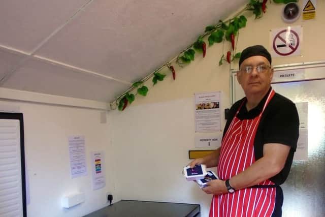 David Gill at his honesty-box curry shed. Picture: SWNS