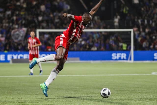 Usain Bolt controls the ball during an exhibition football match. Picture: Getty Images
