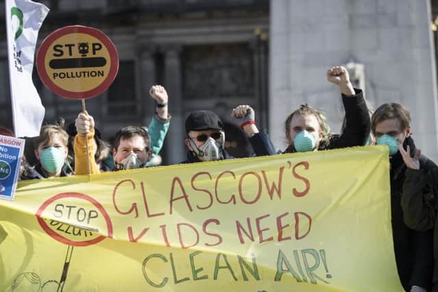 Air pollution protesters hold a 'die-in' at Glasgow's George Square (Picture: John Devlin)