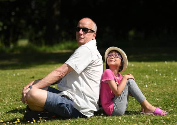 People enjoy the hot weather in Queen's Park, Glasgow