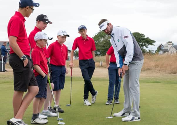 Scott Jamieson with youngsters at Montrose Links. Picture Stuart Adams