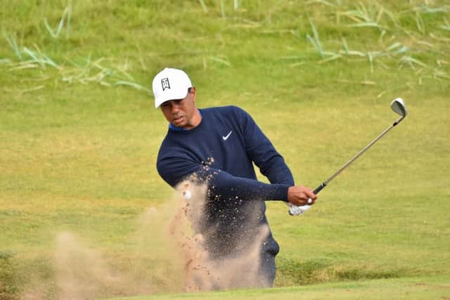 Tiger Woods plays out of a greenside bunker on the 6th hole during a practice round at The Open at Carnoustie. Picture: Glyn Kirk/AFP/Getty