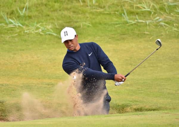 Tiger Woods plays out of a greenside bunker on the 6th hole during a practice round at The Open at Carnoustie. Picture: Glyn Kirk/AFP/Getty