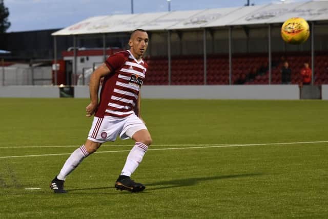 Darian MacKinnon misses his spot-kick. Picture: SNS