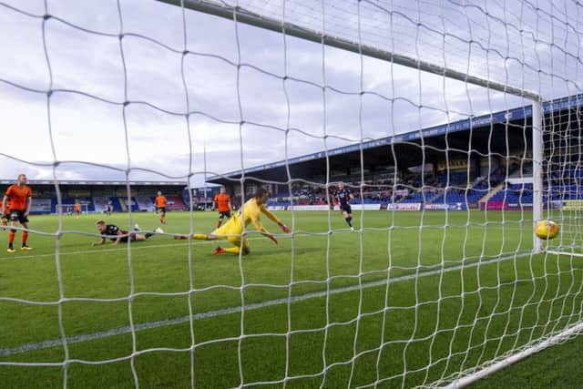 Jamie Lindsay scores the only goal of the game. Picture: SNS