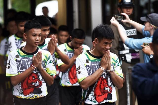Some of the twelve Thai boys, rescued from a flooded cave after being trapped, arrive to attend a press conference in Chiang Rai. Picture: AFP