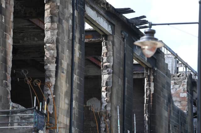 Workmen continue to stabilise the remains of the Mackintosh building at Glasgow School of Art. Picture: Jeff J Mitchell/Getty