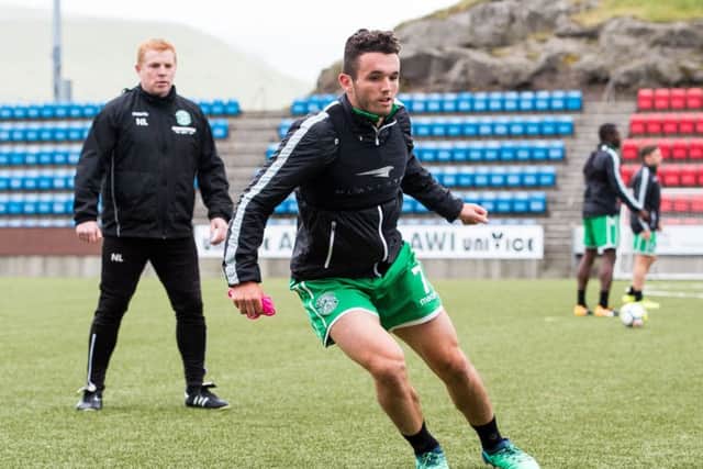 Hibernian manager Neil Lennon watches over John McGinn during training in the Faroe Islands. Picture: Ross Parker/SNS