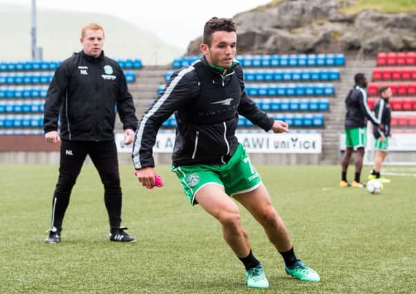 Hibernian manager Neil Lennon watches over John McGinn during training in the Faroe Islands. Picture: Ross Parker/SNS