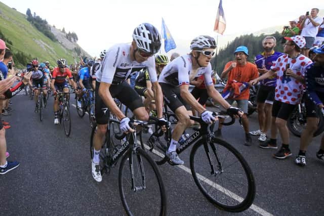 Chris Froome, left, and Geraint Thomas climb together during Stage 11. Picture Peter Dejong/AP