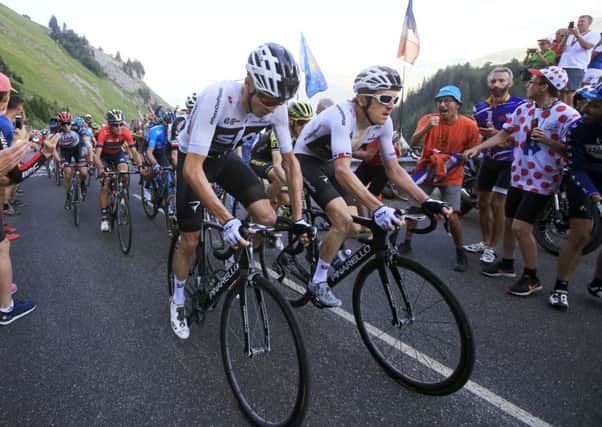 Chris Froome, left, and Geraint Thomas climb together during Stage 11. Picture Peter Dejong/AP