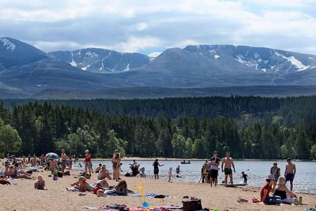 Sunbathers enjoy the heatwave in the Cairngorms. Picture: PA