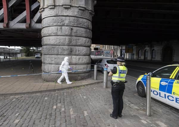 Police at the scene of the attack on the Broomielaw. Picture: John Devlin