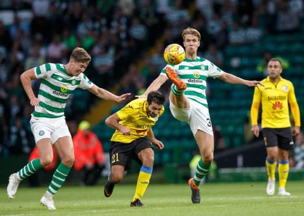 Celtic's Kristoffer Ajer, right, plays the ball during the Champions League qualifier against Alashkert at Celtic Park. Picture: Robert Perry/PA Wire.