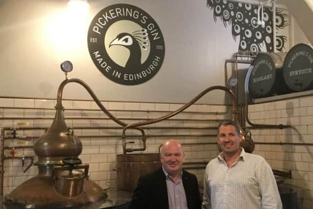 Gordon Macdonald MSP and Matt Gammell, head distiller and co-founder at Pickering's Gin Distillery. Picture: Contributed