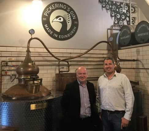 Gordon Macdonald MSP and Matt Gammell, head distiller and co-founder at Pickering's Gin Distillery. Picture: Contributed