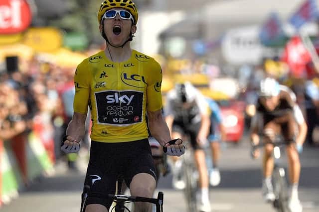 Geraint Thomas roars as he crosses the finishing line. Picture Marco Bertorello/AFP/GETTY