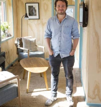 Josh Littlejohn in one of the eco-friendly houses at the new Social Bite village in Granton, Edinburgh. Picture: Ian Rutherford