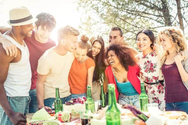 Host a barbecue in your garden and ask each guest to bring a dish along. Picture: PA