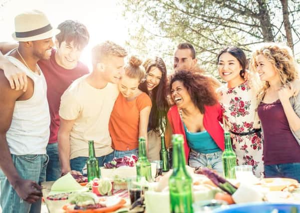 Host a barbecue in your garden and ask each guest to bring a dish along. Picture: PA
