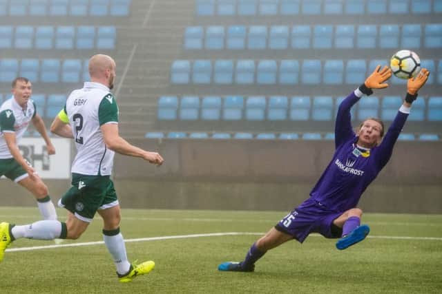 David Gray scores Hibs third goal against NSI Runavik on Thursday. Picture: SNS.