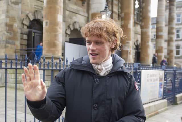 Outlander star Sam Heughan outside the St Andrews-in-the-Square in Glasgow. Picture: John Devlin