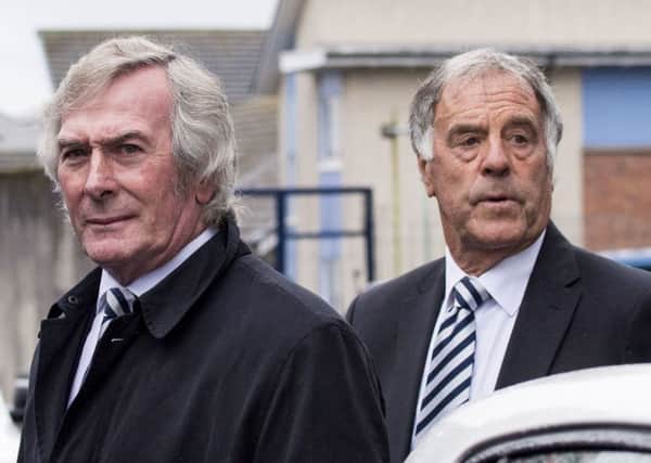 Pat Jennings, left, and Mike England pay their respects at the funeral of Alan Gilzean. Picture: SNS.