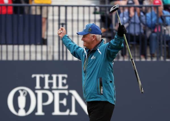 Sandy Lyle acknowledges the cheers after sinking his marvellous birdie putt at one of the toughest closing holes. Picture: David Davies/PA
