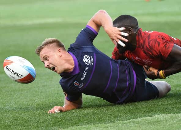 Harvey Elms of Scotland is tackled by Samuel Oliech of Kenya during their men's round of 16 games at the Rugby Sevens World Cup in the AT&T Park at San Francisco, Picture; Getty