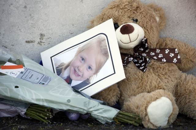 Tributes near a house on Ardbeg Road on the Isle of Bute in Scotland, after the body of Alesha MacPhail was found in woodland on the site of a former hotel by a member of the public. Picture; PA