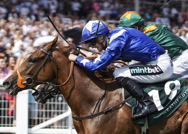 Harry Bentley riding Ginger Nut (blue) win The Weatherbys Super Sprint Stakes at Newbury. Pic: Alan Crowhurst/Getty Images