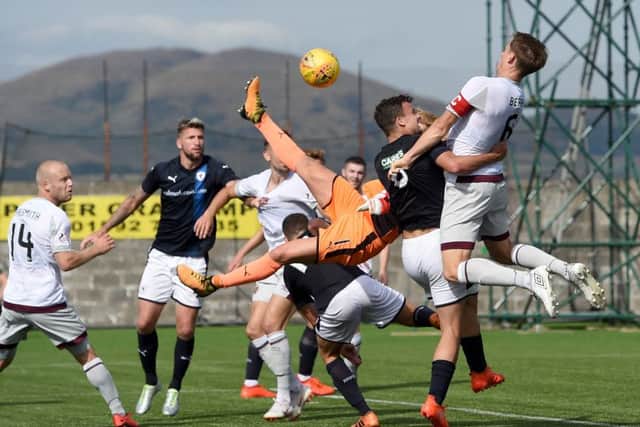 Christophe Berra rises to head the ball into the back of the net but the goal was disallowed. Picture: SNS.